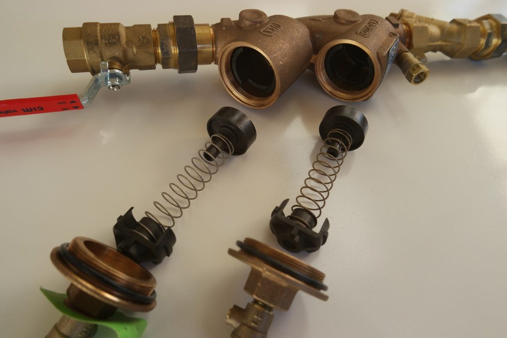 parts exposed during repair backflow preventer service